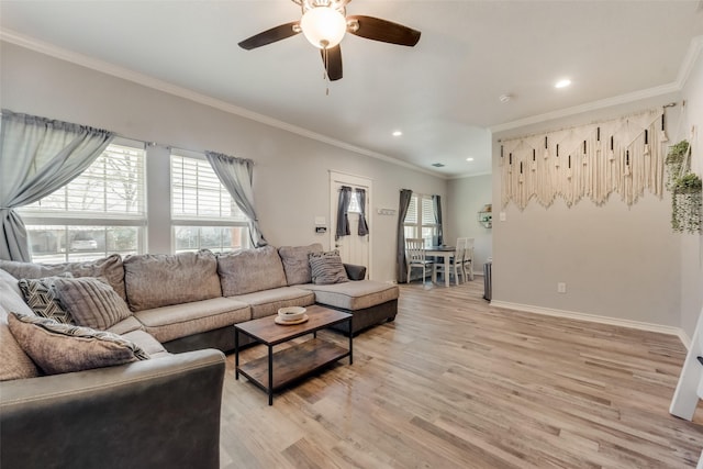 living area featuring recessed lighting, light wood-style flooring, ceiling fan, baseboards, and crown molding