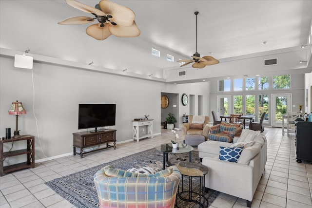 living area with visible vents, ceiling fan, light tile patterned flooring, and high vaulted ceiling