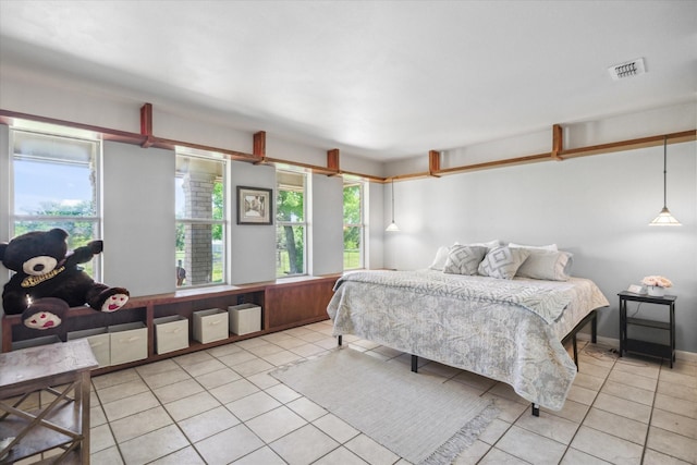 bedroom featuring light tile patterned floors and visible vents