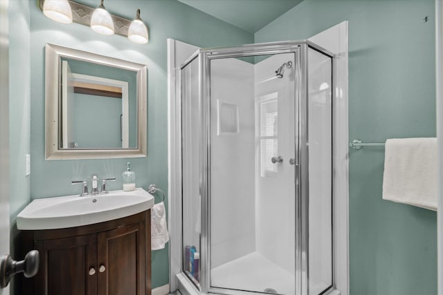 bathroom with vanity and a stall shower