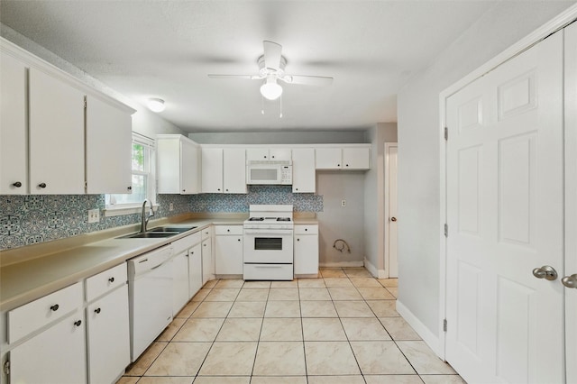 kitchen with ceiling fan, backsplash, a sink, white cabinets, and white appliances