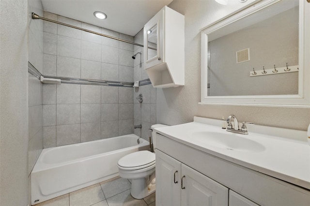 bathroom featuring vanity, toilet, tile patterned floors, tub / shower combination, and visible vents
