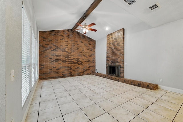 unfurnished living room with vaulted ceiling with beams, a ceiling fan, a brick fireplace, and a wealth of natural light