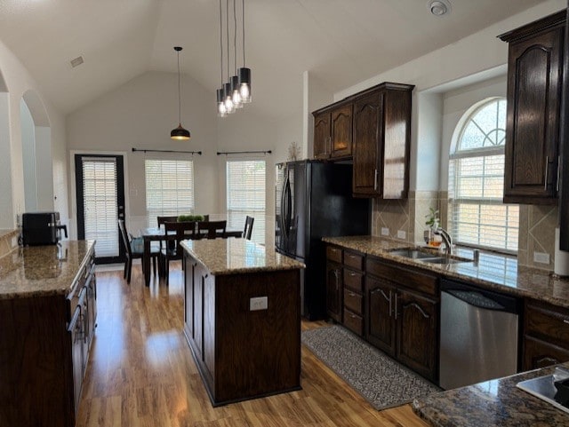 3609 S Texas Dr, Sachse, TX 75048 - kitchen with light stone counters, a sink, dishwasher, freestanding refrigerator, and wood finished floors