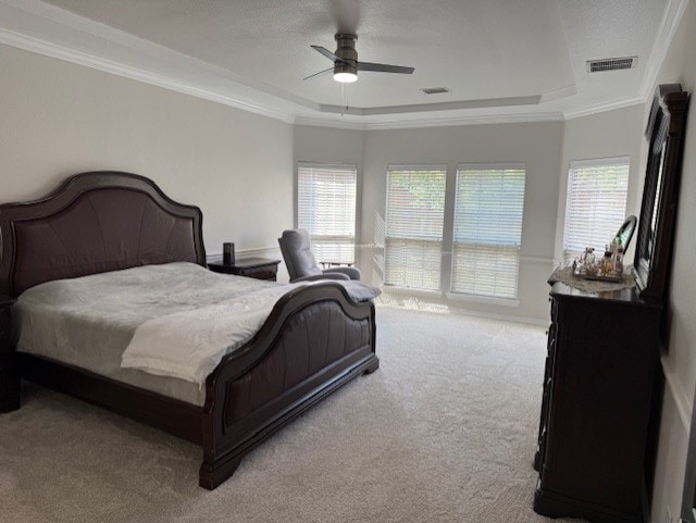 3609 S Texas Dr, Sachse, TX 75048 - carpeted bedroom with crown molding, a ceiling fan, visible vents, and a raised ceiling