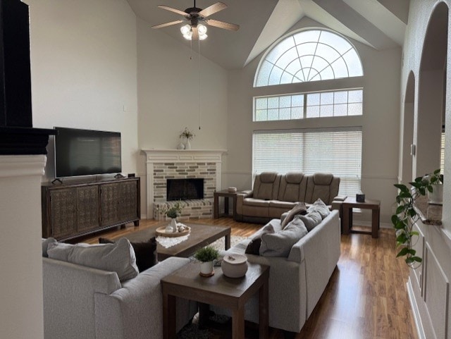 3609 S Texas Dr, Sachse, TX 75048 - living room featuring a ceiling fan, high vaulted ceiling, wood finished floors, and a fireplace