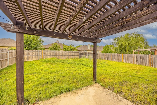 view of yard featuring a pergola and a fenced backyard