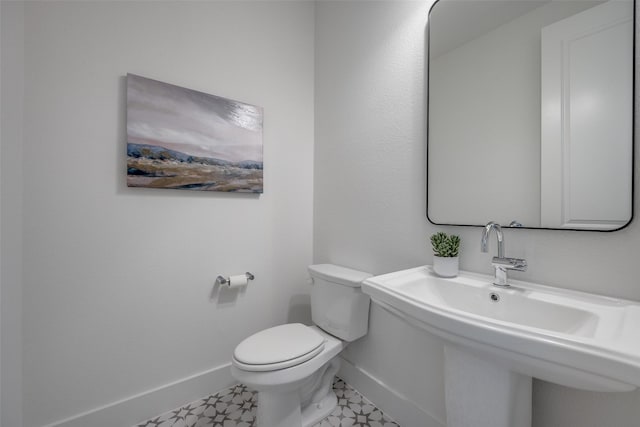 1823 Bell Ct, Van Alstyne, TX 75495 - bathroom with baseboards and toilet