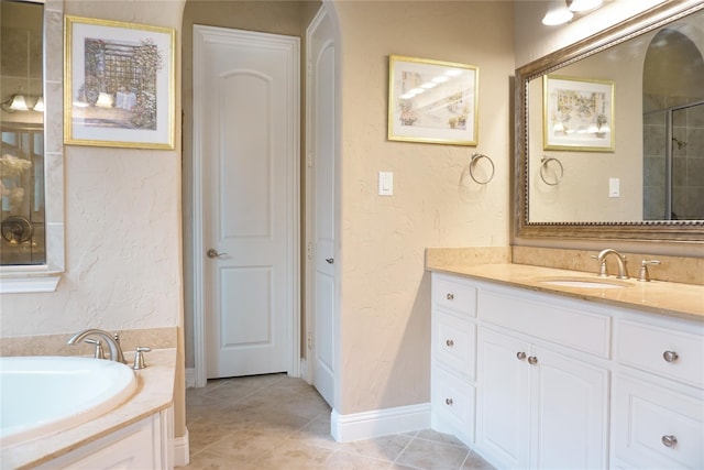 1852 Audubon Pond Way, Allen, TX 75013 - bathroom with vanity, a garden tub, a textured wall, and tile patterned floors