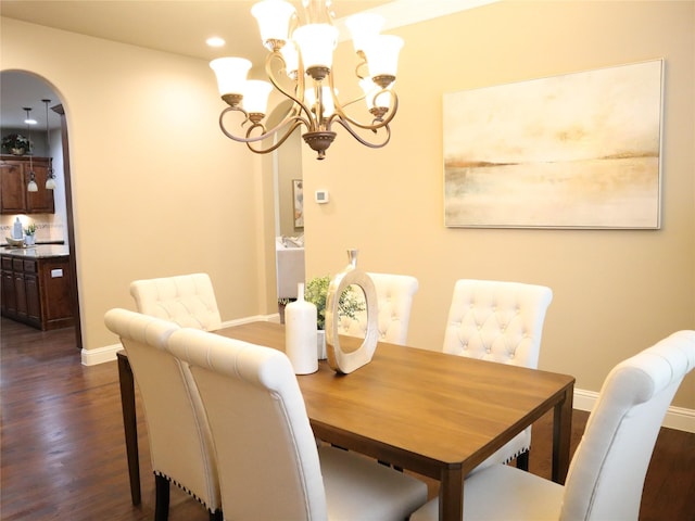 1852 Audubon Pond Way, Allen, TX 75013 - dining area with dark wood-style floors, arched walkways, a chandelier, and recessed lighting
