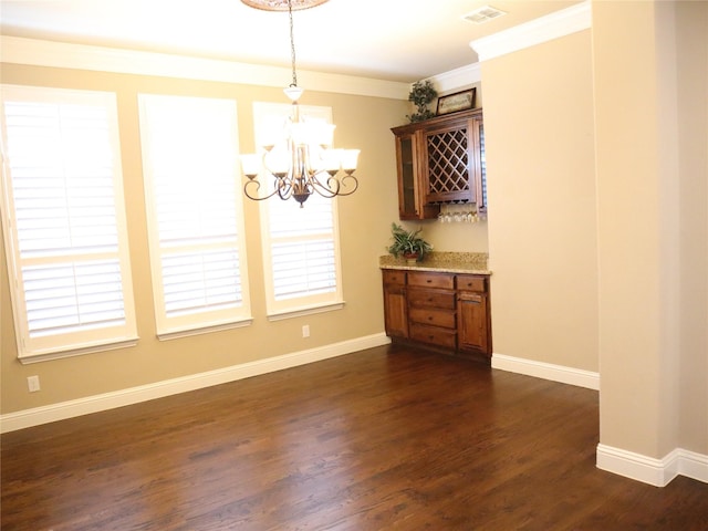 1852 Audubon Pond Way, Allen, TX 75013 - unfurnished dining area featuring baseboards, ornamental molding, dark wood-style floors, and a notable chandelier