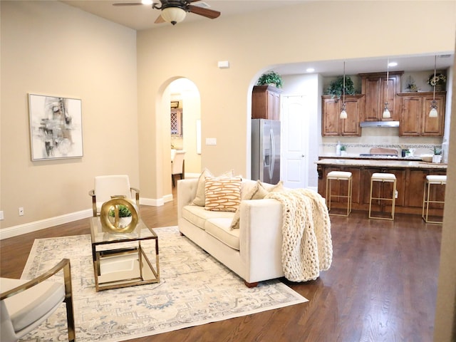1852 Audubon Pond Way, Allen, TX 75013 - living room featuring arched walkways, ceiling fan, dark wood-type flooring, and recessed lighting