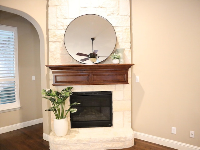 1852 Audubon Pond Way, Allen, TX 75013 - detailed view of arched walkways, wood finished floors, a stone fireplace, and ceiling fan