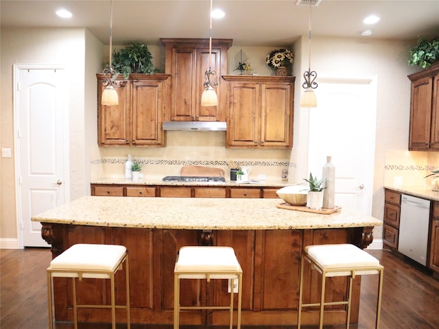 1852 Audubon Pond Way, Allen, TX 75013 - kitchen featuring dishwasher, under cabinet range hood, dark wood finished floors, a kitchen bar, and recessed lighting