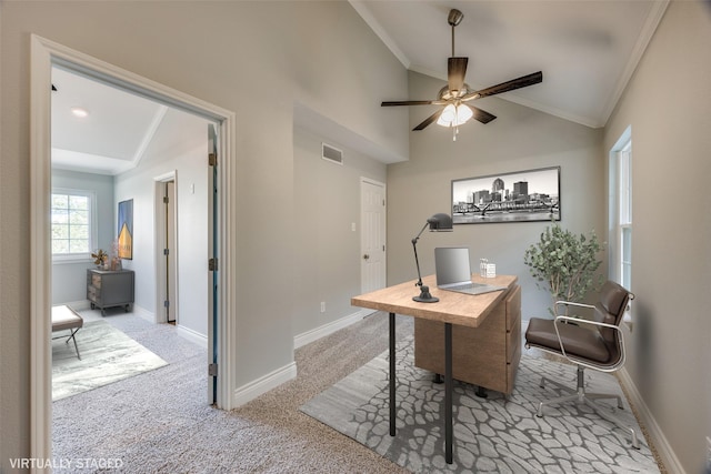 office area with crown molding, a ceiling fan, visible vents, light carpet, and baseboards