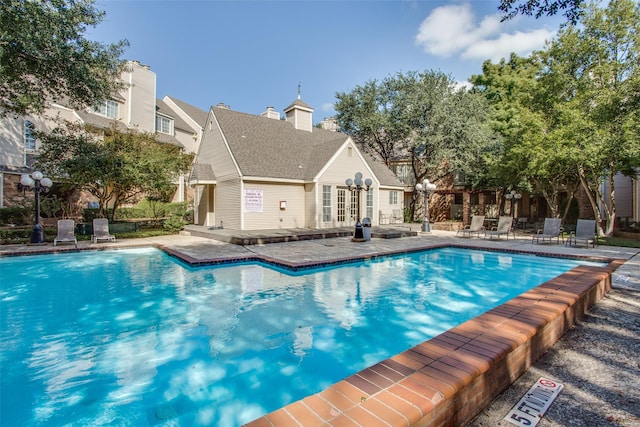 pool with a patio and french doors