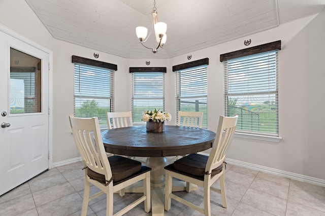dining area with an inviting chandelier, a wealth of natural light, baseboards, and light tile patterned flooring