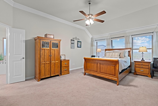 bedroom featuring lofted ceiling, ceiling fan, baseboards, ornamental molding, and light carpet