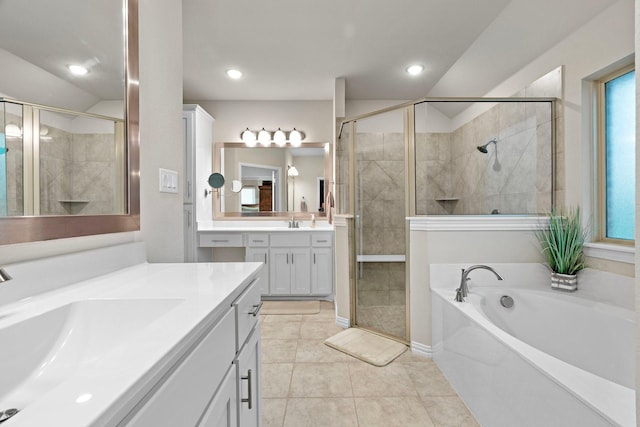 full bath with two vanities, a sink, a shower stall, and tile patterned floors