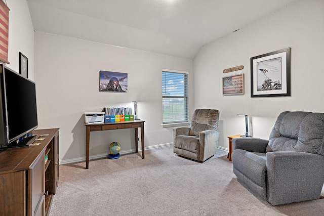 living area featuring baseboards, lofted ceiling, and carpet flooring