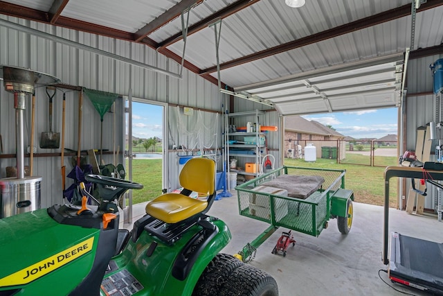 garage featuring metal wall and a water view
