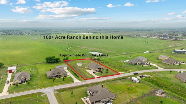 birds eye view of property featuring a rural view