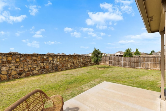 view of yard featuring a patio and a fenced backyard