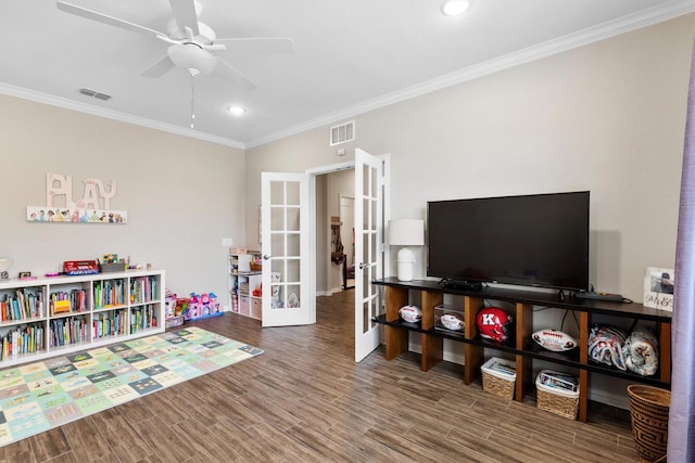 recreation room featuring ceiling fan, visible vents, french doors, and crown molding