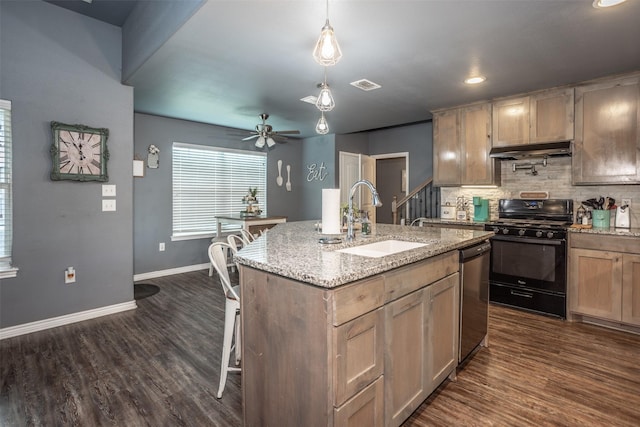 kitchen featuring a sink, black range with gas stovetop, under cabinet range hood, visible vents, and dishwasher