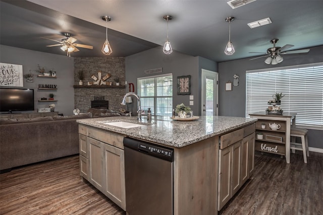 kitchen featuring a ceiling fan, stainless steel dishwasher, dark wood-style flooring, and a sink