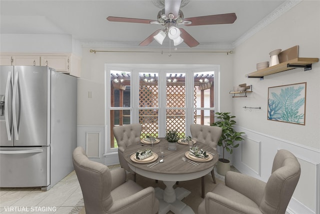 832 Ridgeview Dr, Burleson, TX 76028 - dining room featuring crown molding, ceiling fan, a wainscoted wall, and a decorative wall