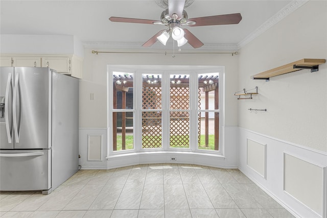 832 Ridgeview Dr, Burleson, TX 76028 - unfurnished dining area featuring ceiling fan, a wainscoted wall, and a wealth of natural light