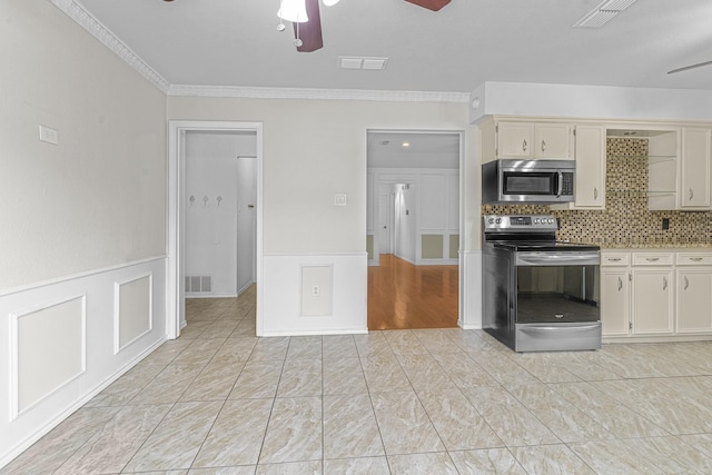 832 Ridgeview Dr, Burleson, TX 76028 - kitchen with a ceiling fan, stainless steel appliances, and visible vents