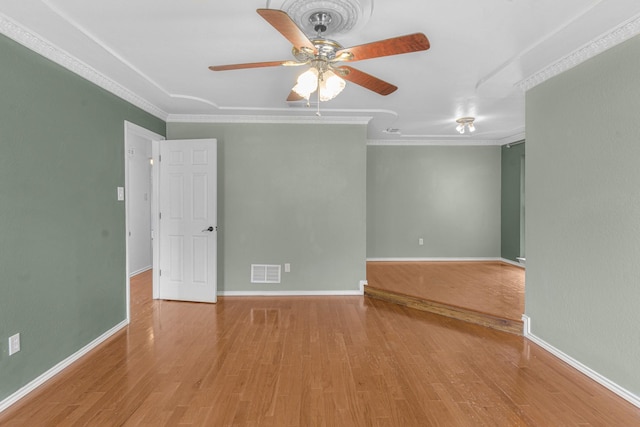 832 Ridgeview Dr, Burleson, TX 76028 - spare room with visible vents, a ceiling fan, wood finished floors, and ornamental molding