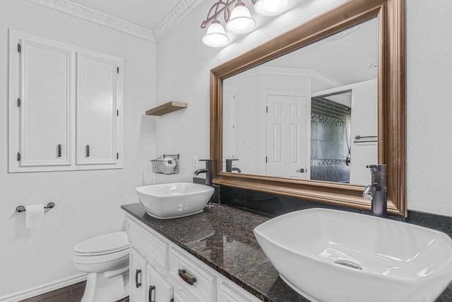 832 Ridgeview Dr, Burleson, TX 76028 - bathroom featuring double vanity, a sink, a tile shower, and toilet