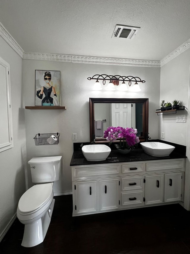 832 Ridgeview Dr, Burleson, TX 76028 - bathroom with a sink, double vanity, a textured ceiling, and visible vents