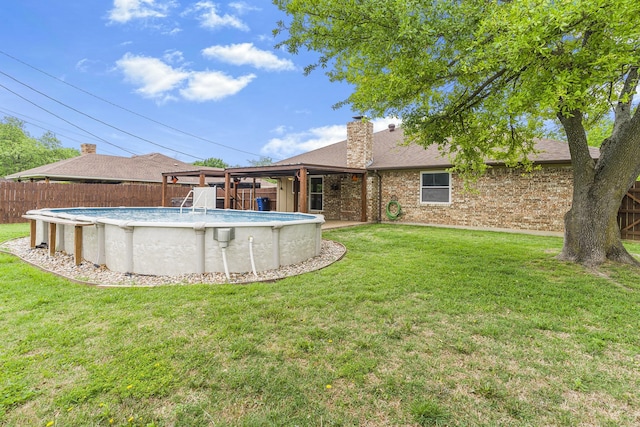 832 Ridgeview Dr, Burleson, TX 76028 - rear view of house with brick siding, a fenced backyard, a fenced in pool, a chimney, and a yard
