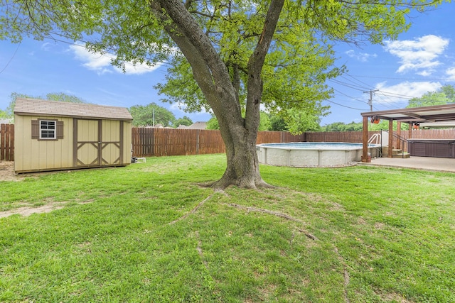 832 Ridgeview Dr, Burleson, TX 76028 - view of yard featuring a storage unit, a fenced backyard, a fenced in pool, and an outdoor structure