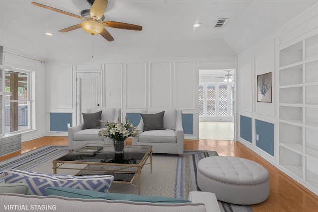 832 Ridgeview Dr, Burleson, TX 76028 - living area featuring visible vents, a decorative wall, a healthy amount of sunlight, wood finished floors, and a ceiling fan