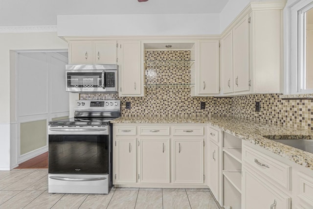 832 Ridgeview Dr, Burleson, TX 76028 - kitchen featuring appliances with stainless steel finishes, tasteful backsplash, and light stone counters