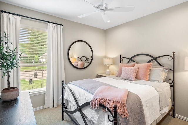 bedroom featuring carpet, a ceiling fan, and baseboards