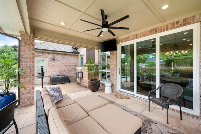 view of patio / terrace with a ceiling fan and an outdoor living space