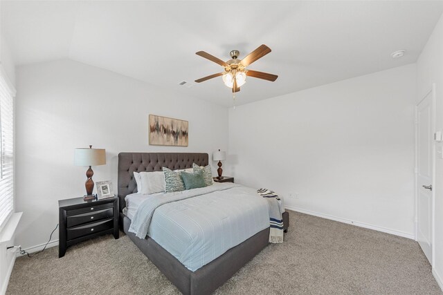 carpeted bedroom with baseboards and ceiling fan
