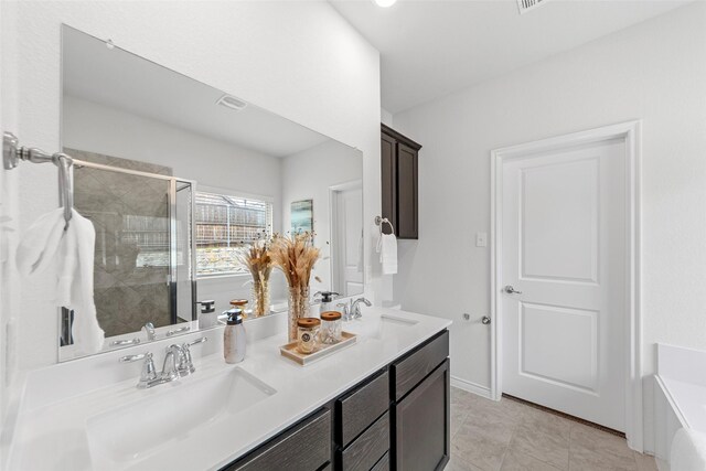 bathroom featuring double vanity, a shower stall, a sink, and a tub to relax in