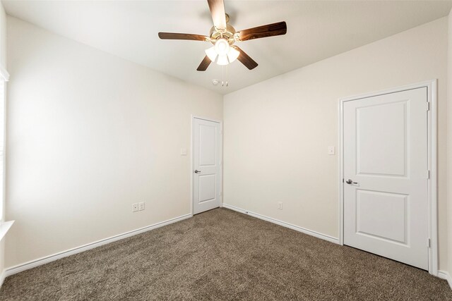 unfurnished room featuring baseboards, carpet flooring, and ceiling fan