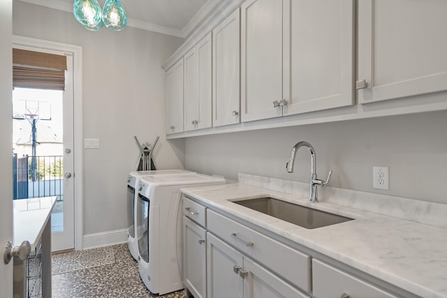 4260 Tranquility Ln, Prosper, TX 75078 - washroom featuring separate washer and dryer, cabinet space, ornamental molding, a sink, and baseboards