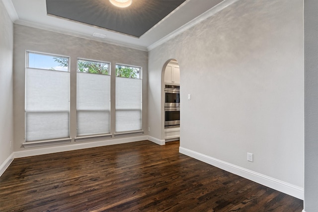3404 Ophel Way, Flower Mound, TX 75028 - unfurnished room featuring arched walkways, baseboards, dark wood-style floors, and ornamental molding