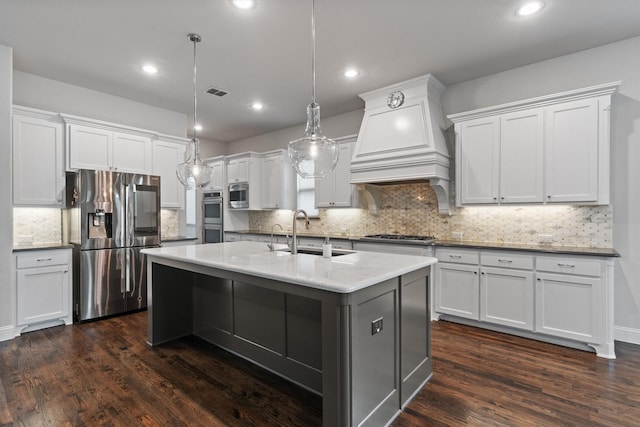3404 Ophel Way, Flower Mound, TX 75028 - kitchen featuring decorative backsplash, appliances with stainless steel finishes, dark wood finished floors, a sink, and white cabinets