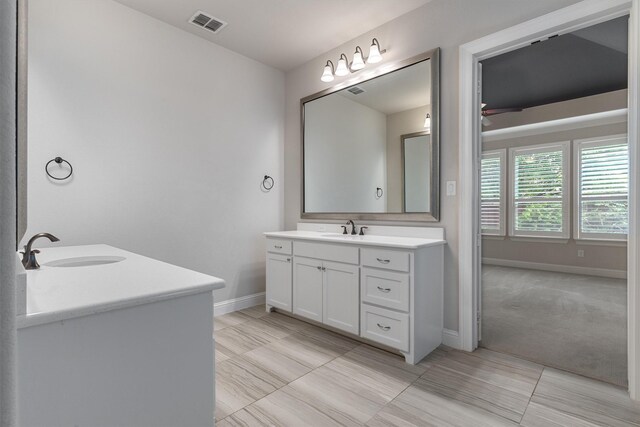 3404 Ophel Way, Flower Mound, TX 75028 - bathroom with a sink, baseboards, visible vents, and two vanities