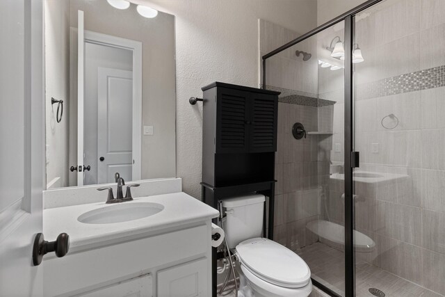 3404 Ophel Way, Flower Mound, TX 75028 - bathroom with vanity, a stall shower, and toilet